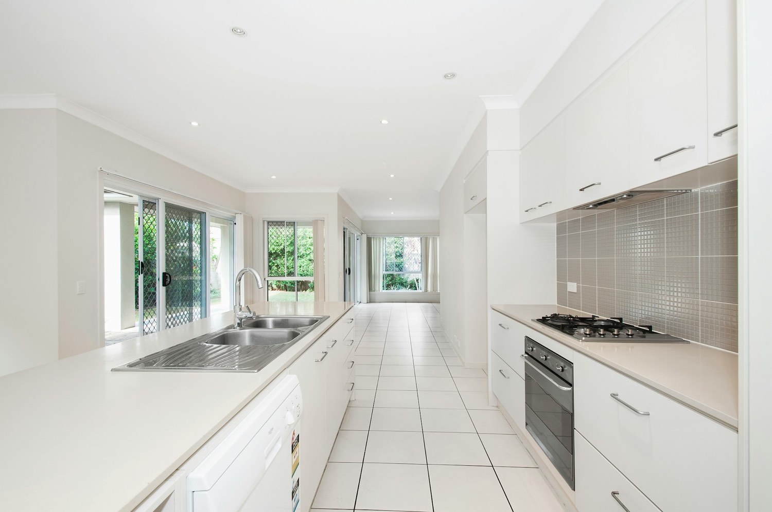 Finished shaker kitchen doors in satin white on spray racks
