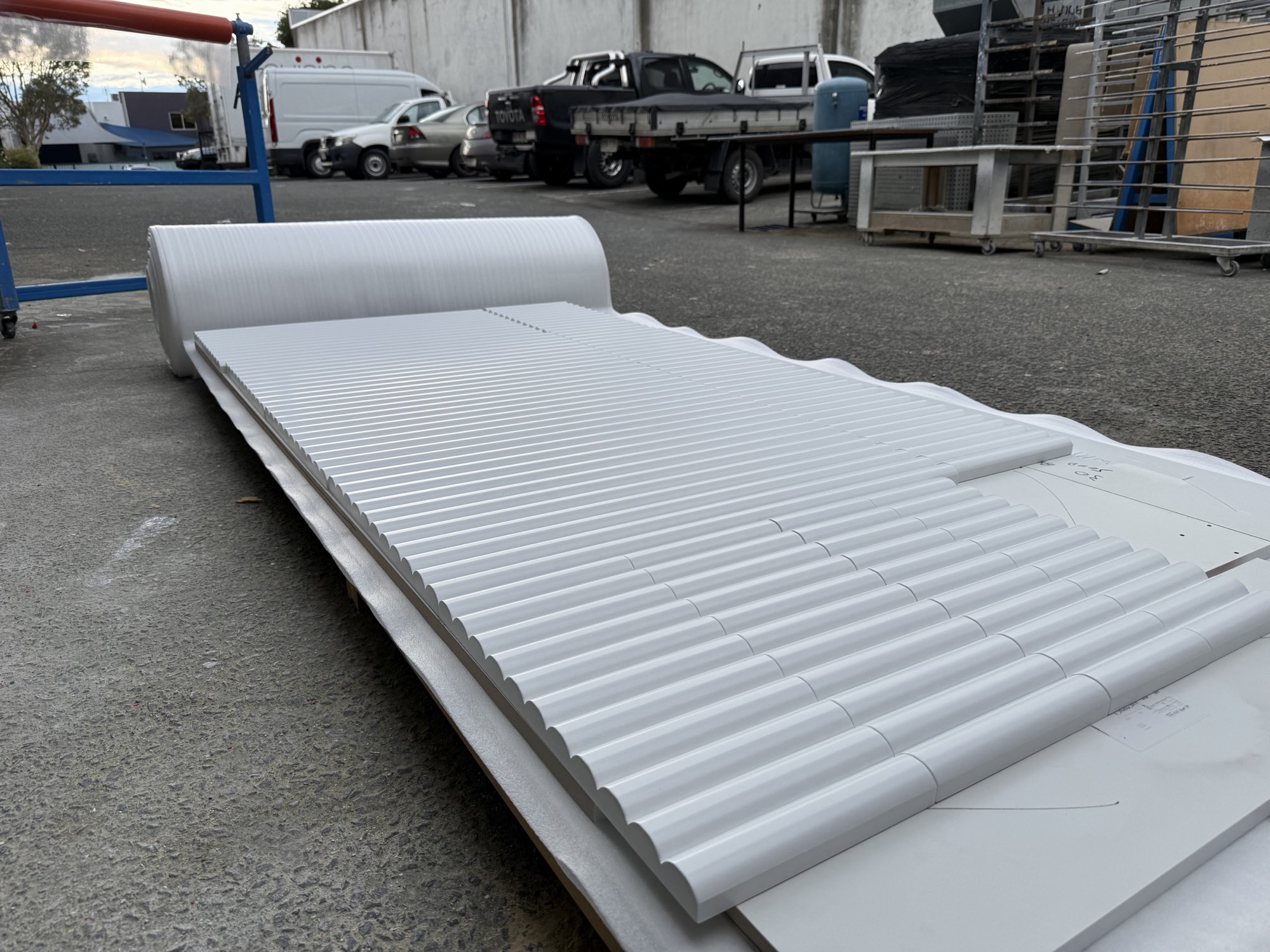 A finished fluted panel run in white, packed and ready to go back